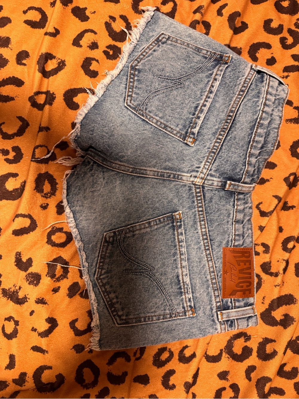 REVICE Light Wash Denim Cutoff Shorts